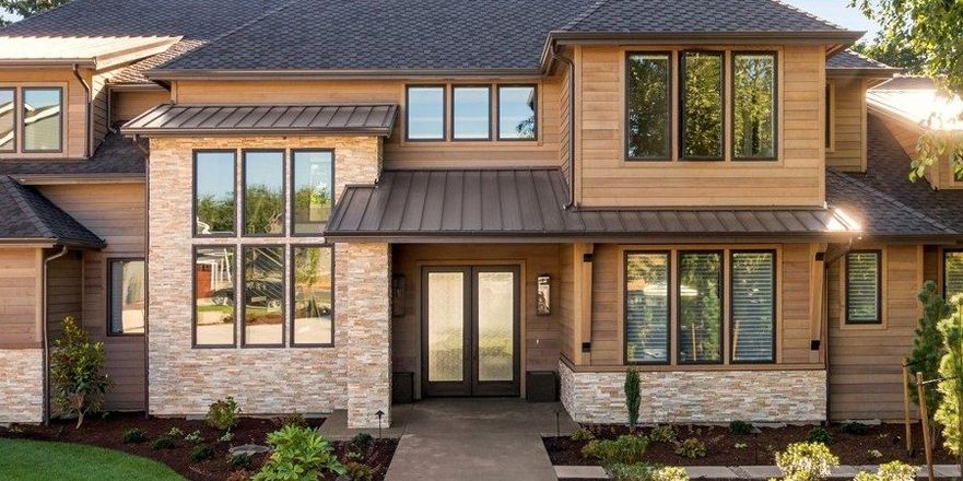 New architectural shingle and standing-seam metal roofing on an Oklahoma home